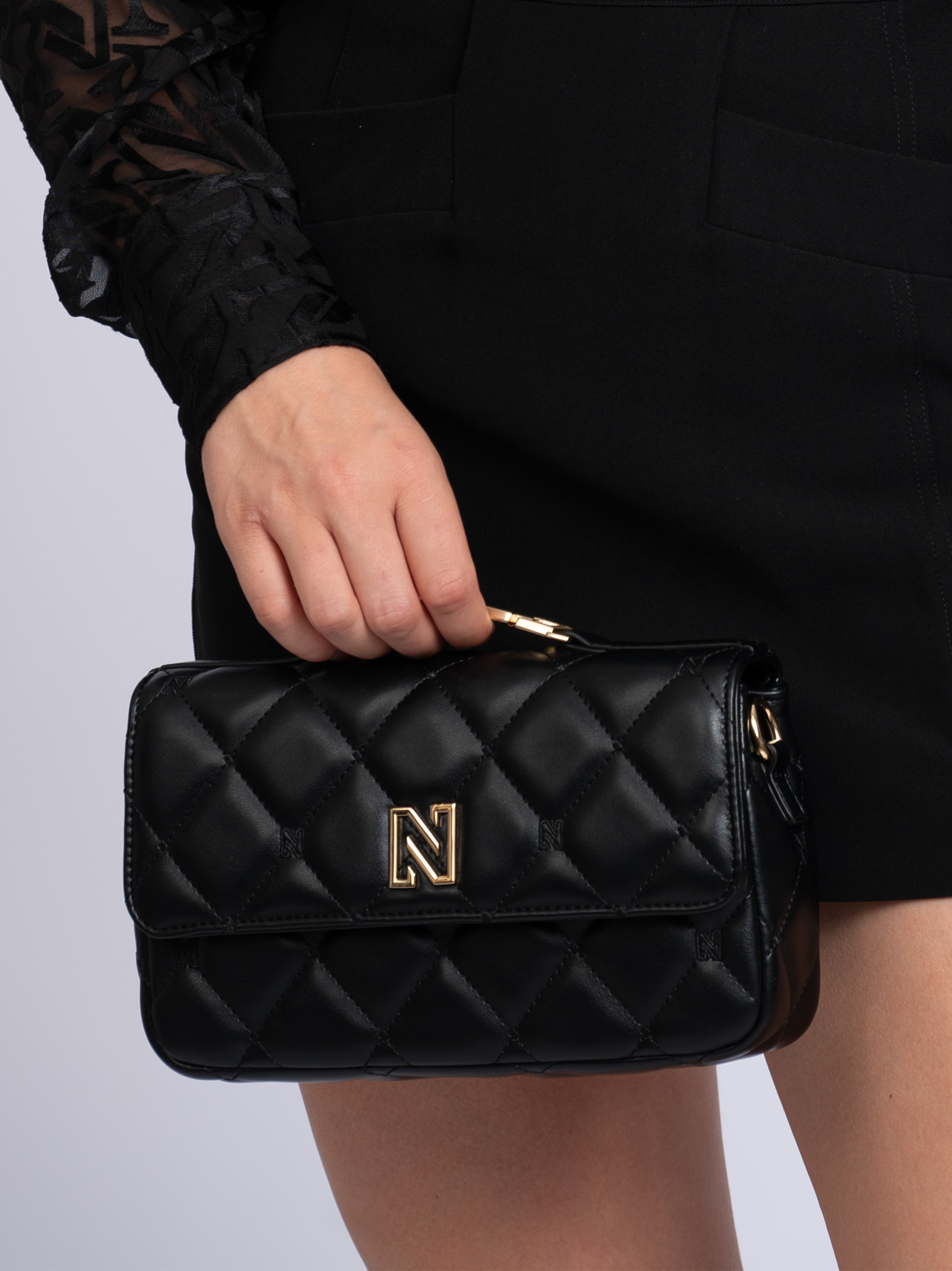 Quilted clutch with handle and N logo