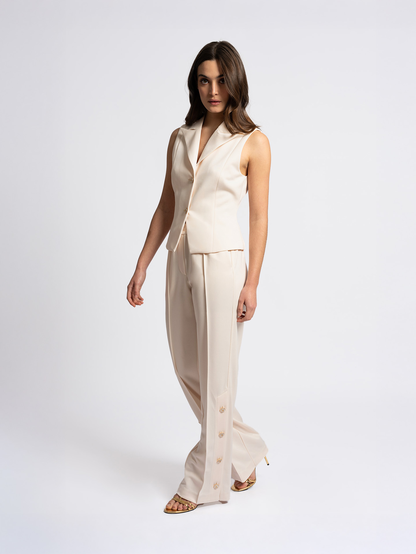 Track pants with mother-of-pearl buttons