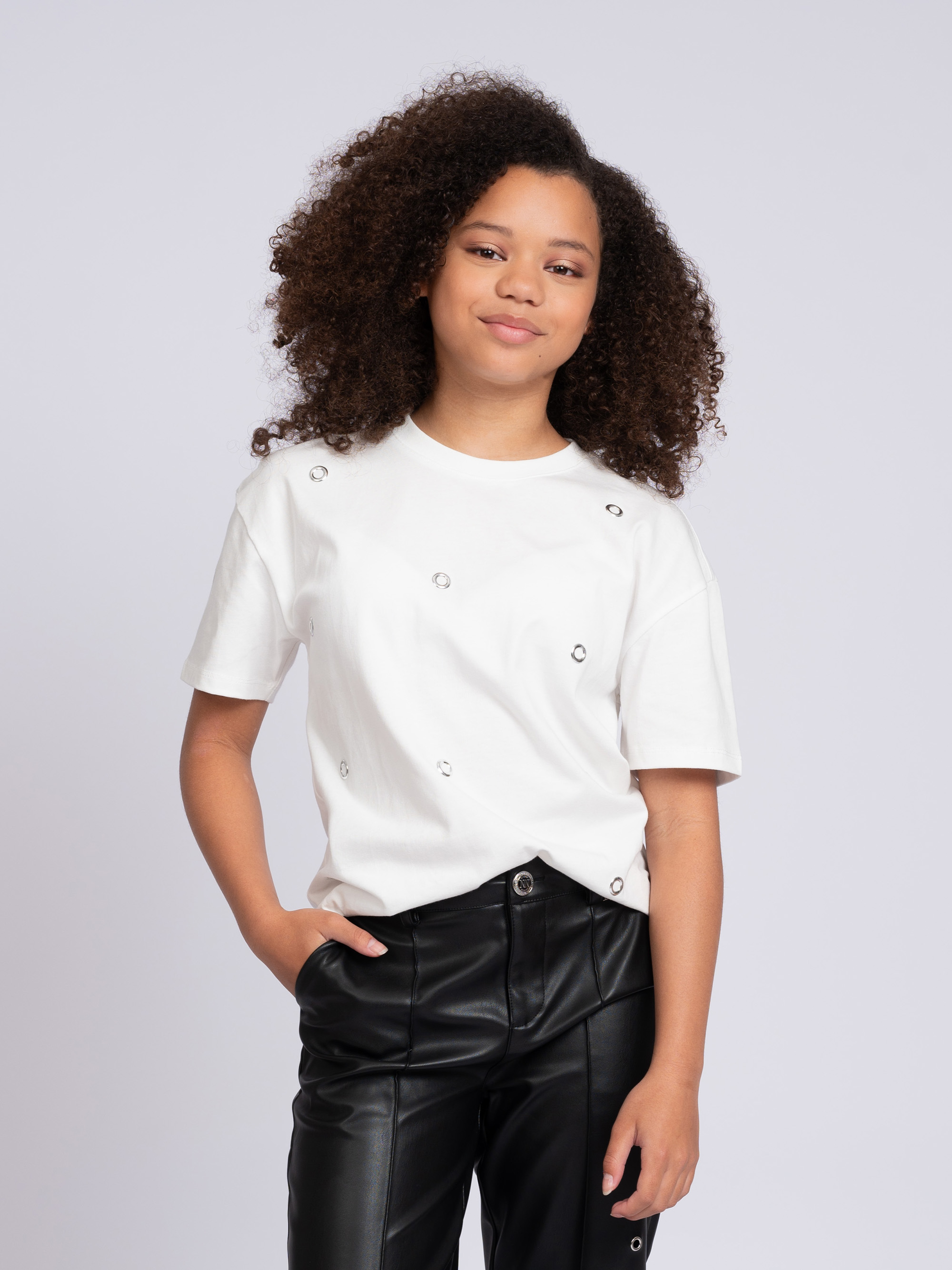 T-shirt with decorative rings